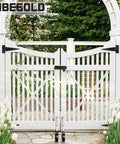Heavy Duty 5 Inch Spring Loaded Gate Caster Smooth Operator Design For Outdoor Wooden Fences Rock Solid Anti Sag Support Wheel With 360 Degree Swivel And Durable White Housing Handles 220 Lbs No Sweat seen mounted on a white garden gate.