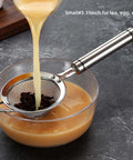 304 Stainless Steel Fine Mesh Strainer With Handle Skimmer for tea over bowl, showing liquid being poured through, 3.35 inch size.
