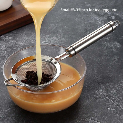 304 Stainless Steel Fine Mesh Strainer With Handle Skimmer for tea over bowl, showing liquid being poured through, 3.35 inch size.