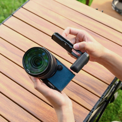 Person adjusting Street Ready S9 Hand Grip For Panasonic Lumix S9 Camera With L Shape Bracket And Built In Arca Quick Release Plate
