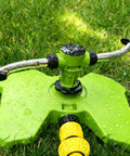 Heavy Duty Two Arm Sprinkler With Brass Nozzle For Big Yards And Gardens 360 Degree Automatic Rotary Lawn Irrigation System on grass