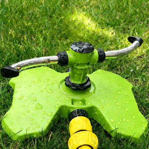 Heavy Duty Two Arm Sprinkler With Brass Nozzle For Big Yards And Gardens 360 Degree Automatic Rotary Lawn Irrigation System on grass