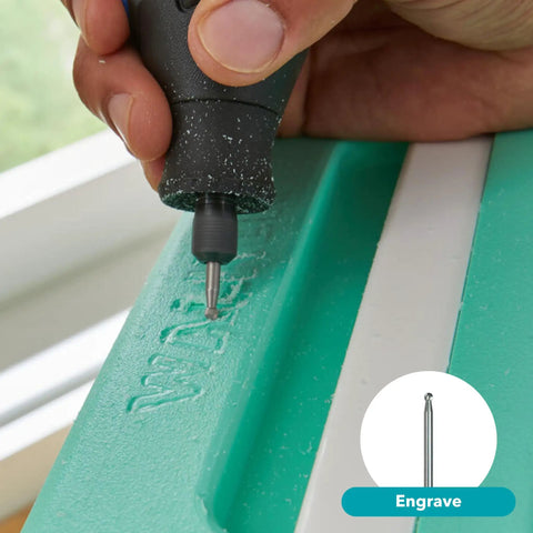 Using Top Notch Variable Speed Rotary Tool Kit With Badass One Point Six Amp Motor Dialing Up To Thirty Five Thousand Rpm to engrave a green surface.
