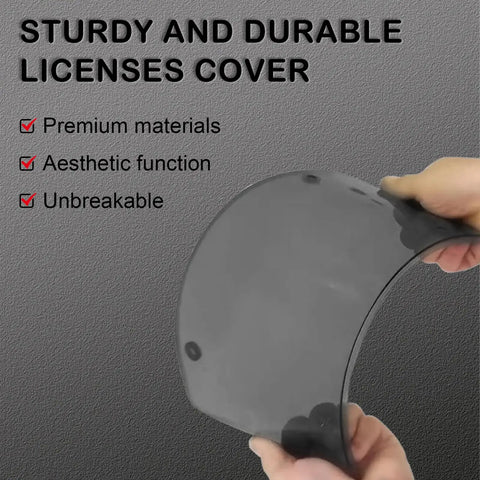 Hands holding Gray Framed Bubble License Plate Cover Set 2 Pack Curved ABS Shield For 12x6 US Plates, showcasing durability.