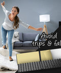 Woman avoiding fall on rug with 8 Pack Non Slip Rug Grips For Mats And Rugs Self Adhesive Pad Strips in living room