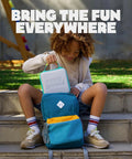 Child putting Playground Active Travel Case For Game System Lightweight Durable Portable Storage in a backpack outdoors