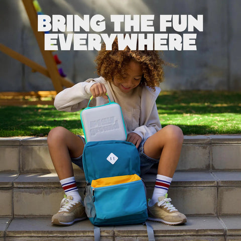 Child putting Playground Active Travel Case For Game System Lightweight Durable Portable Storage in a backpack outdoors