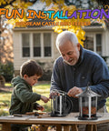 Two Pack Outdoor Hanging Bird Feeders With Quick One Minute Setup And Charming Castle Design Attracting Cardinals Chickadees Goldfinches And Sparrows Black Easy To Assemble For Family Fun And A Great Gift. An older man and child assembling the feeder on a wooden table outdoors in a yard.