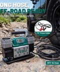 Heavy Duty 12V Air Compressor Tire Inflator With Auto Shut Off Digital Preset 150PSI Rapid Fill placed near off-road tire.