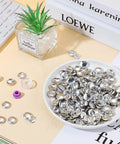 100 Pack DIY Button Kit With Wire Backs And Tools displayed in a dish, fabric buttons size 24 for clothes and crafts.