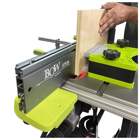 Versatile 36-Inch XT XTENDER Table Saw Fence System in use, clamping wood. Visible 5-Inch tall design, three T-slots, and clamp slots.