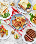 Aigostar 3 In 1 Electric Sandwich Maker With Removable Nonstick Plates Panini Press Grill And Waffle Iron 750W meal spread with sandwiches and waffles.