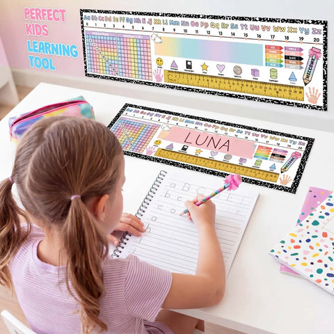Young girl using 60 Pcs Classroom Desk Name Tags Set with Alphabet, Number Line, 100 Chart for 1st to 3rd Grade learning.