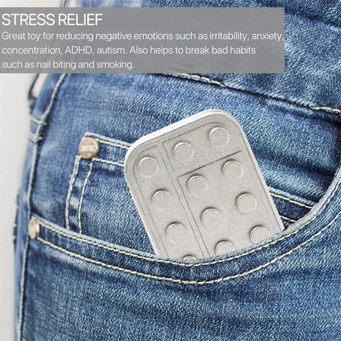 Heavy Duty Metal Fidget Slider Featuring Unlimited Rotary Push Brick Design For Adults ADHD Anxiety And Stress Relief Smooth As Butter Gliding Action tucked in denim pocket.
