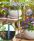 Solar Powered Automatic Drip Irrigation System Kit For DIY Gardens And Indoor Outdoor Use With 9 Timing Modes And Anti Siphon Prevent Battery Backup Weatherproof IP65 Great For Balcony Patio And Yard in use, watering potted plants on a patio table.