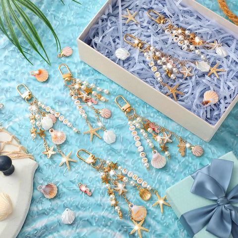 Seashell Keychain Making Kit With 776 Pieces Including Alphabet Beads, White Pearls, Clear Spacer Beads, And 60 Pendants Displayed