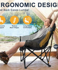 Person relaxing in ergonomic Oversized Camping Chair For Adults With Cup Holder And Side Pocket, supports up to 500 lbs, grey.