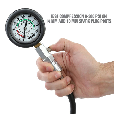 Hand holding Garage Ready Compression Tester Gauge Set for Cars and Trucks with Flexible Hose Includes 14mm and 18mm Adapters