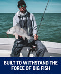 Angler holding fish using Fierce IV Spinning Reel And Fishing Rod Combo For Saltwater Angling With Full Metal Body HT 100 Drag