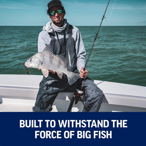 Angler holding fish using Fierce IV Spinning Reel And Fishing Rod Combo For Saltwater Angling With Full Metal Body HT 100 Drag