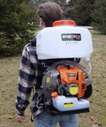 Person using Backpack Mosquito Fogger Mister Duster Sprayer Model 870 For Killer Backyard Pest Control Cold Fogger Ultra Lightweight 22 Lb Unit Powerful 51.7cc Engine High CFM Mist Blower For Crops And Yard in a grassy area.