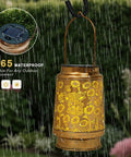 Watering Can Lantern Lights Solar Outdoor Garden Decor Waterproof Kettle Lamp with flower pattern in rain.
