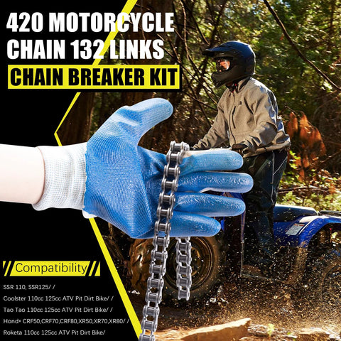 Close-up of a silver 420 motorcycle chain held by a blue-gloved hand, ATV rider in background
