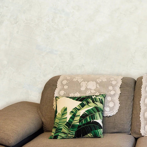 Peel And Stick Marble Wallpaper Roll Covers Countertops And Fridges With A Slick Removable Oil Proof Finish Straight Up Easy Self Adhesive Marbling Decal That Adheres Tight Without Residue For A Solid Home Upgrade applied on a light wall behind a sofa.