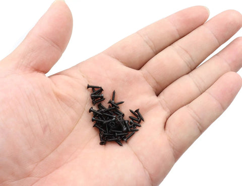 Straight Up Heavy Duty Flat Head Self Tapping Screw Assortment Kit For Wood And Sheet Metal In Black Carbon Steel Nine Sizes One Hundred Pieces Each For Top Shelf Durability in palm.