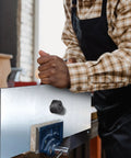 Person using Hydraulic Knockout Punch Set, 15-Ton Handheld Conduit Hole Cutter Kit on metal sheet secured in vice
