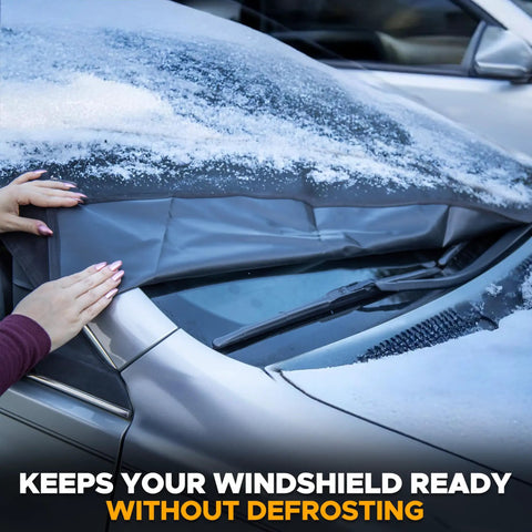 Universal Windshield Cover For Ice And Snow being placed on car with visible snow and anti theft straps in use
