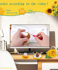 Beginner Crochet Kit Starter Set With Coasters And Plant Pot Projects, hands crocheting with TV tutorial, desk setup