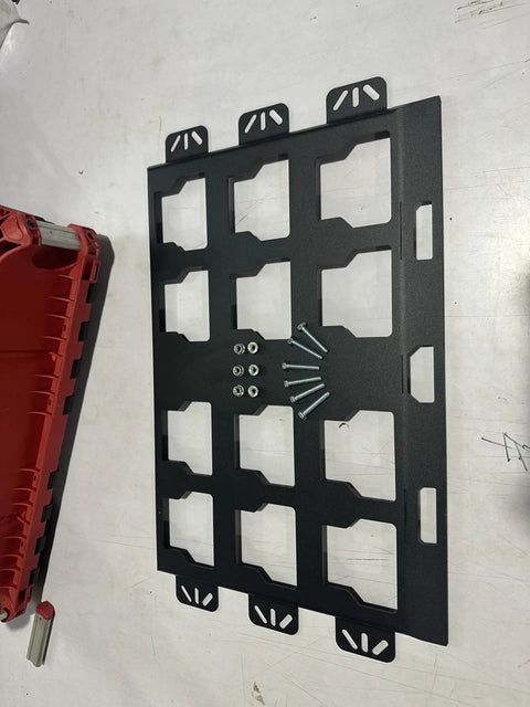 Milwaukee Packout Wall Mounting Plate Dope Metal Base, screws visible, on white surface, compatible with MOLLE panels