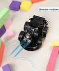 R3 Smart Robot Car Kit V4 For Arduino showing obstacle avoidance with foam blocks, perfect for STEM education coding and engineering.