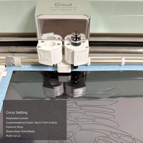 Front view of Cricut cutting machine head cutting 12x12 in opaque black PET stencil sheet