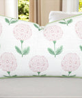 Pink Block Print Marigold Lumbar Pillow Cover 12x20 off-white slub cover with pink floral print and green piping on sofa