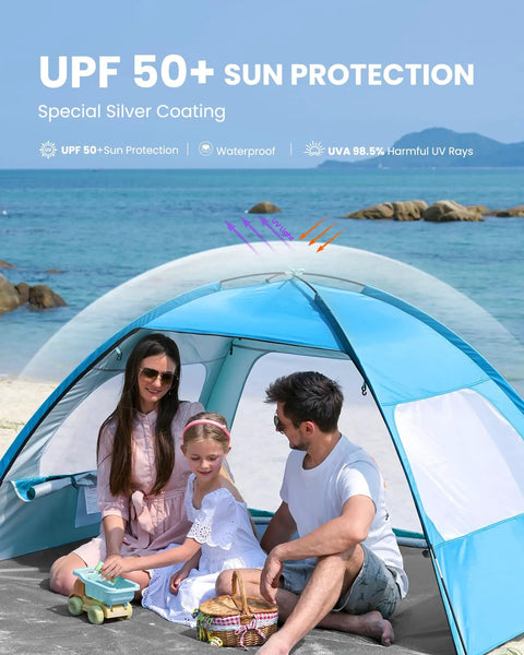 Family enjoying beach under Spacious Beach Tent For Three To Four People With No Fuss Setup Sun Shade Canopy Portable UPF Fifty Plus UV Protection