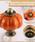 Orange Pumpkin Ceramic Cabinet Knob with bronze details in a set including screws, shown from various angles.