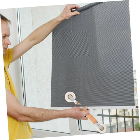 Person using Window Screen Spline Roller Tool With Durable Wooden Handle For Easy Mesh Installation And Quick Repair Kit on window