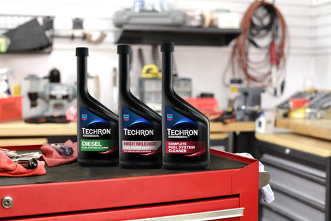 Concentrate Plus Fuel System Cleaner For Cars And Trucks Cleans Injectors And Intake Valves Restores Power Acceleration And Fuel Economy Reduces Rough Idle Surging Hesitation And Spark Plug Fouling 12 Oz Bottle, three bottles on a shop cart