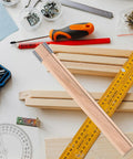 Wooden Drawer Slides with Center Mount Bottom Track for Dresser Repair and Furniture Assembly, seen with tools and screws.