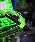 Close-up of a mechanic holding a green C-frame from a 21 Piece Ball Joint Press Kit With Puller And U Joint Adapters For Upper And Lower Ball Joints Brake Pins And More Pro Grade Automotive Tool Set For 2 Wheel Drive And Four Wheel Drive Vehicles