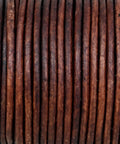 Genuine Round Leather String Cord One Point Five Mm Long Distressed Antique Brown soft twine coiled in a neat bundle.
