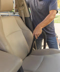 Pro-Grade 1-1/4 In Wet Dry Shop Vac Attachment Kit With Reinforced 11 Ft Hose being used for car seat cleaning.