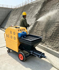 Portable Mortar Plastering Spraying Machine For Sand Cement Render Gypsum Putty Quick Wall Coating Construction Equipment Efficient Handheld Spray Pump in use on a wall.
