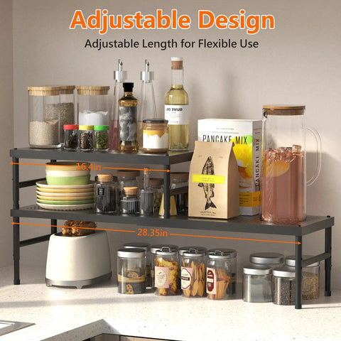 Hella Adjustable And Stackable Kitchen Cabinet Organizer with spices, jars, and bottles on a 16.4in to 28.35in adjustable metal shelf.