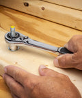 21-Piece Three Eighths Inch Drive Pass-Thru Ratchet And Socket Set SAE Metric with thin head in use tightening bolt on wood
