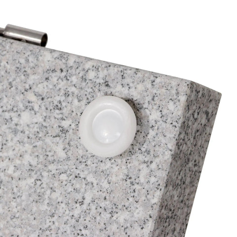 Close-up of Heavy Duty Granite Patio Umbrella Base With Handle And 2 Casters, detailed view of caster on grey stone surface.