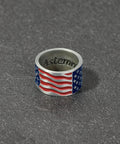 Patriotic American Flag Collar Ring For Walking Canes, 7/8 Inch Inner Diameter, raised star detail, flowing stripe design on gray surface