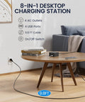 Power Strip Surge Protector With 9.8 Foot Cord And Mountable Design on a table with books and a charging cable setup.